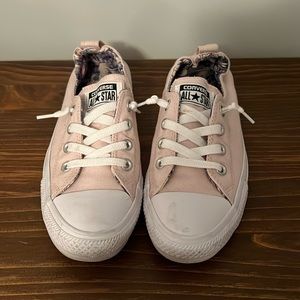 Women’s pink slip on Converse All Star tennis shoe